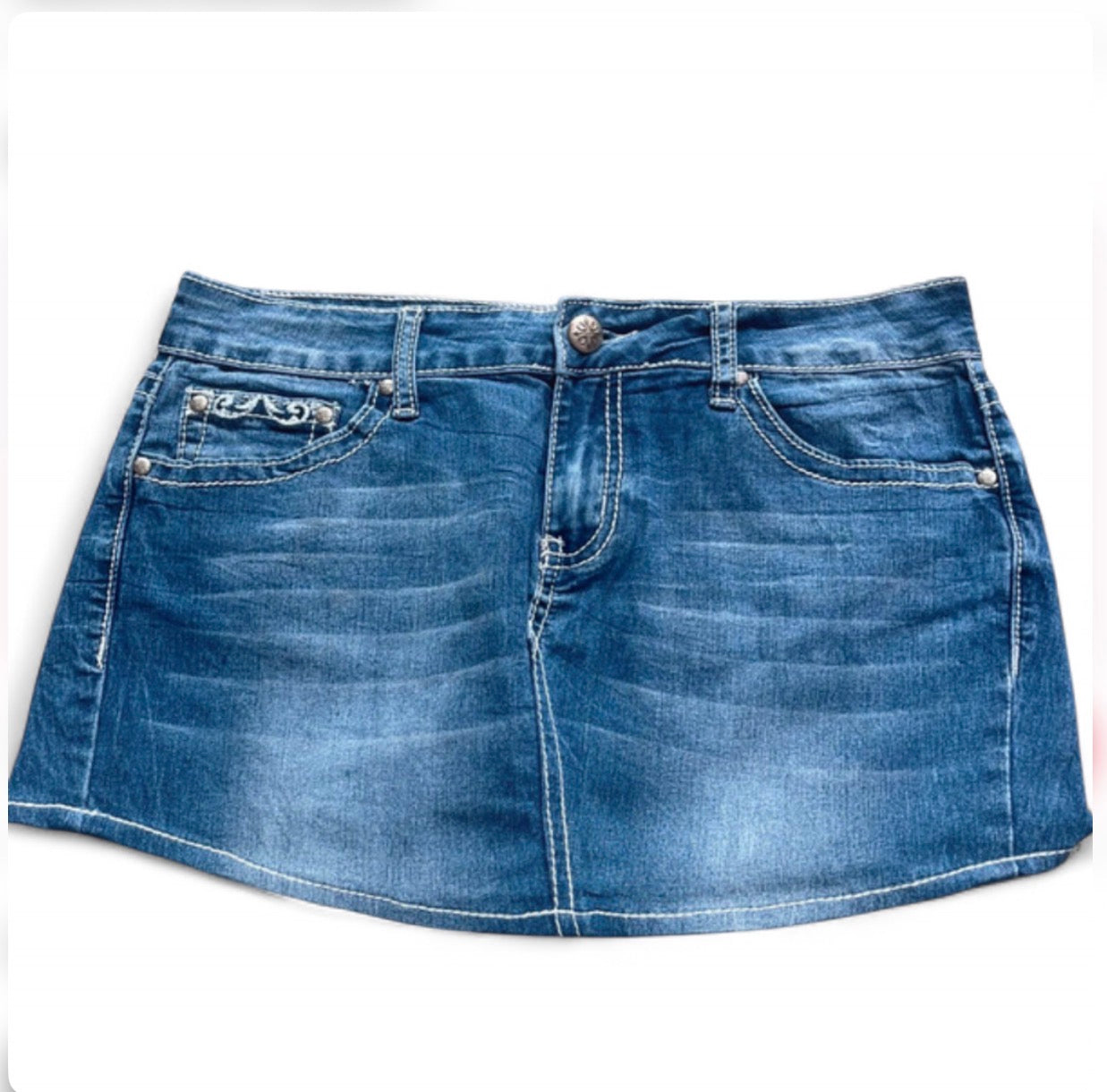 Blue denim skirt on a white background
